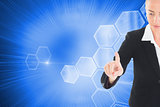 Composite image of businesswoman pointing somewhere