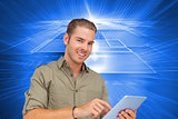 Composite image of happy man using tablet pc