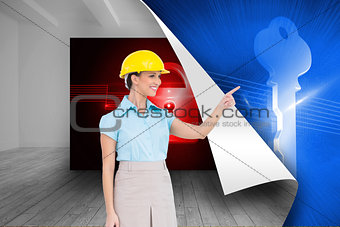 Composite image of smiling attractive architect pointing