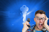 Composite image of frustrated computer engineer screaming while on call in front of open cpu