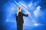 Composite image of businesswoman pointing somewhere
