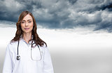 Composite image of happy doctor looking at camera