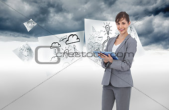 Composite image of smiling businesswoman with tablet computer