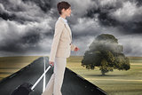 Composite image of serious businesswoman pulling suitcase