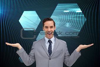 Composite image of smiling businessman presenting something with his hands