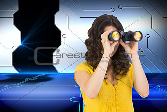 Composite image of casual young woman using binoculars