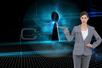 Composite image of smiling businesswoman holding tablet pc
