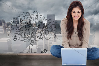 Composite image of woman sitting on the bed with the laptop in front of her and smiling