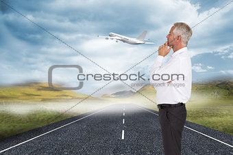 Composite image of thoughtful businessman posing