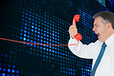Composite image of businessman screaming directly into the handset