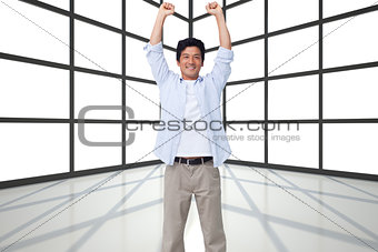 Composite image of cheering male with arms up