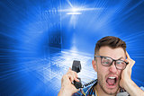Composite image of frustrated computer engineer screaming while on call in front of open cpu