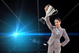 Composite image of businesswoman showing a cup