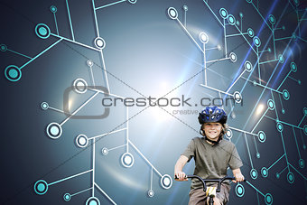 Composite image of little boy with his bike in a park