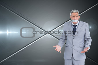Composite image of businessman gagged with adhesive tape on mouth