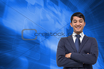 Composite image of smiling asian businessman with arms crossed