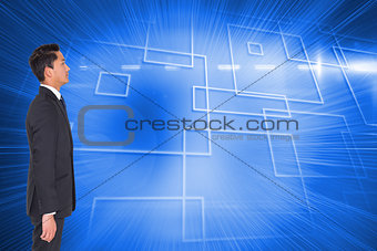 Composite image of unsmiling businessman looking away