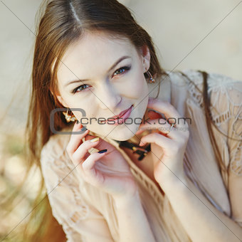 Natural portrait of young beautiful woman outside.