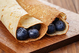 homemade blinis or crepes with blueberries