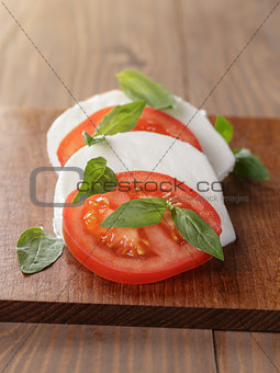 caprese salad made on cutting board