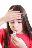 Ill girl child worried with thermometer