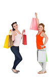 Young female friends with shopping bags