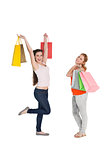 Happy young female friends with shopping bags