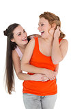 Cheerful young female embracing her friend from behind