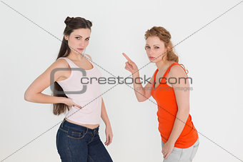 Portrait of angry young female friends having an argument