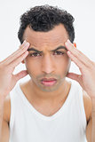 Close-up portrait of a man suffering from headache