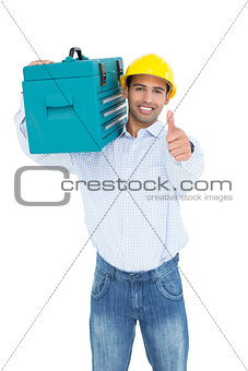 Handyman in hard hat with toolbox gesturing thumbs up
