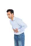 Casual young man with stomach pain