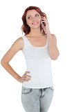 Smiling casual young woman using mobile phone