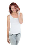 Smiling casual young woman using mobile phone