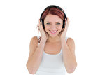 Beautiful casual woman enjoying music through headphones