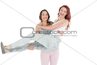 Portrait of a young female carrying her cheerful friend