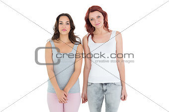 Female friends standing over white background
