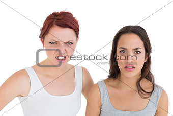 Close-up portrait of two angry young female friends
