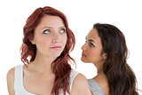 Unhappy young female friends not talking after argument