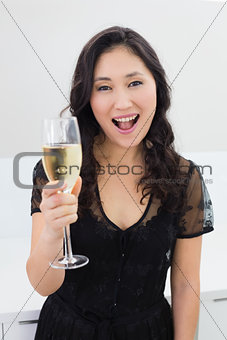 Portrait of a beautiful young woman with champagne
