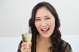 Portrait of a beautiful young woman with champagne