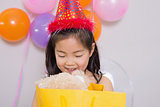 Little girl with gifts at her birthday party