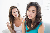 Angry young female friends having an argument