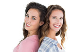 Side view portrait of two happy young female friends