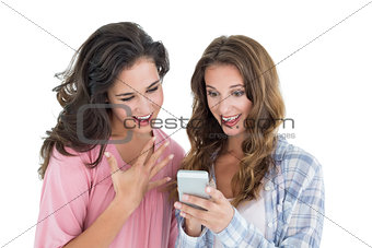 Female friends looking at mobile phone