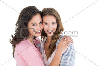Portrait of a young female embracing her friend