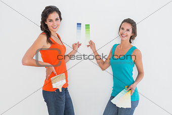 Side view portrait of two female friends choosing color