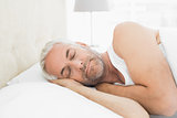 Close-up of a mature man sleeping in bed