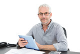 Portrait of a mature businessman with digital tablet and telephone