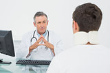 Doctor listening to patient with concentration in office